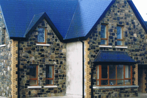 House faced with with Black and Blue Limestone, Yellow and Black coins and Granite