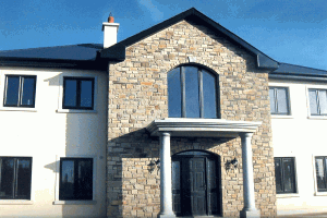 House with Cream Brown Sandstone with a Granite Porch
