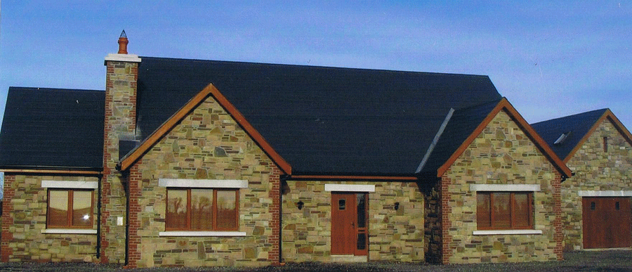 House with Cream and Brown Sandstone Mix, Red Brick coins, Granite window sills and heads
