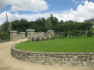 cream brown sandstone entrance with garden wall